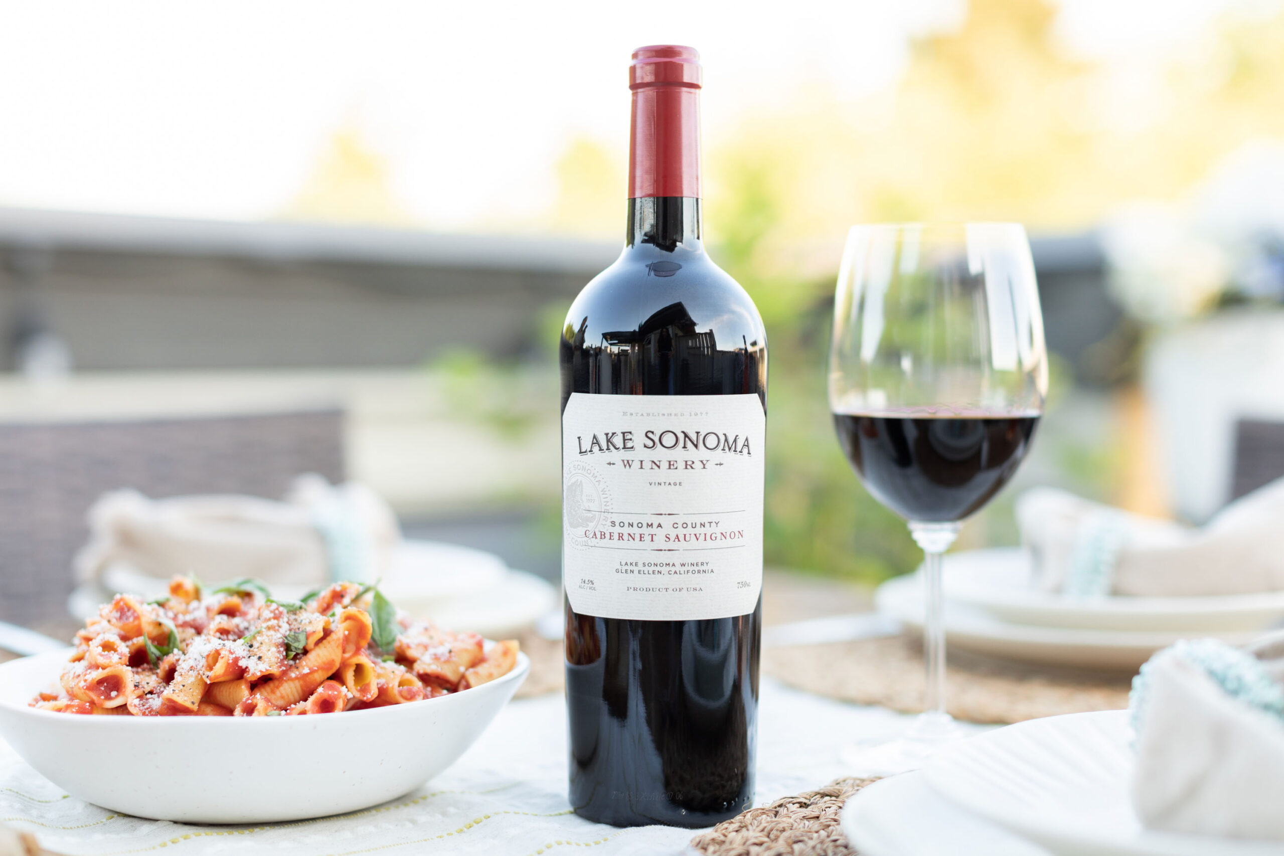 Lake Sonoma Cabernet Sauvignon Sonoma County bottle shot with glass of wine and plate of pasta